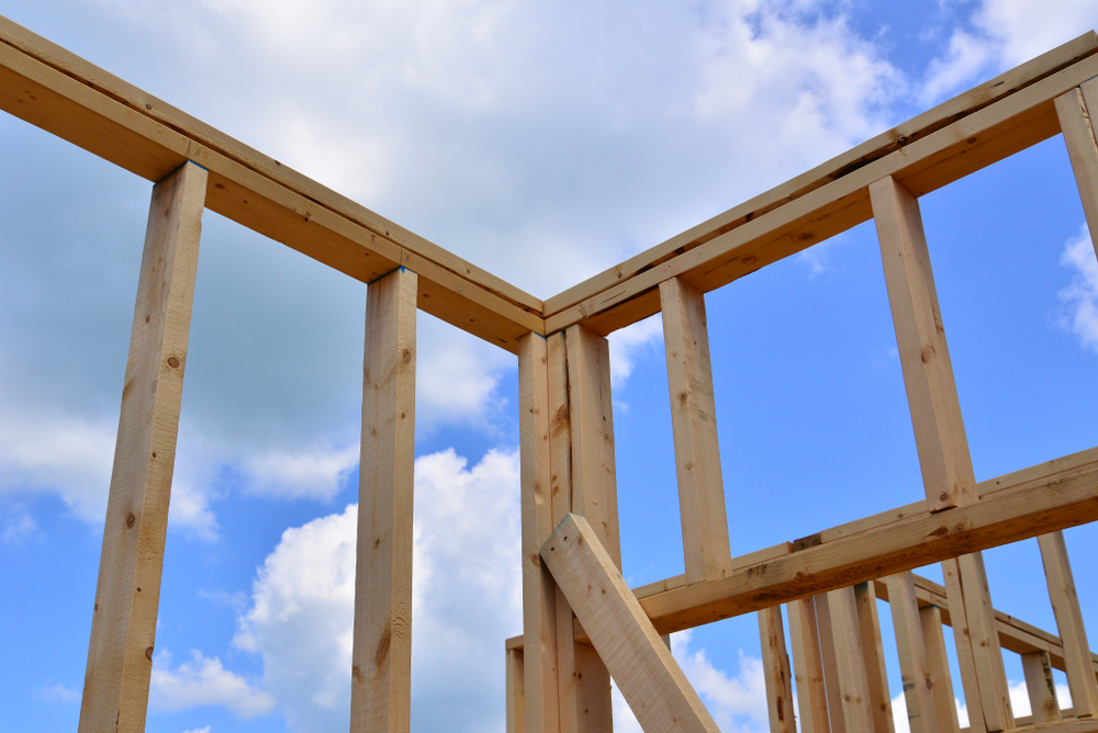 Exterior,Wall,Framing,Intersecting,With,Blue,Clouded,Sky,On,The