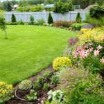View,Of,A,Green,Lawn,Surrounded,By,Colorful,Flowers.,Landscaping.